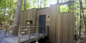 The Gateway Isidore wheelchair accessible tiny house in a beautiful forest.