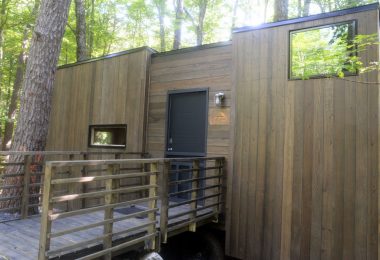 The Gateway Isidore wheelchair accessible tiny house in a beautiful forest.