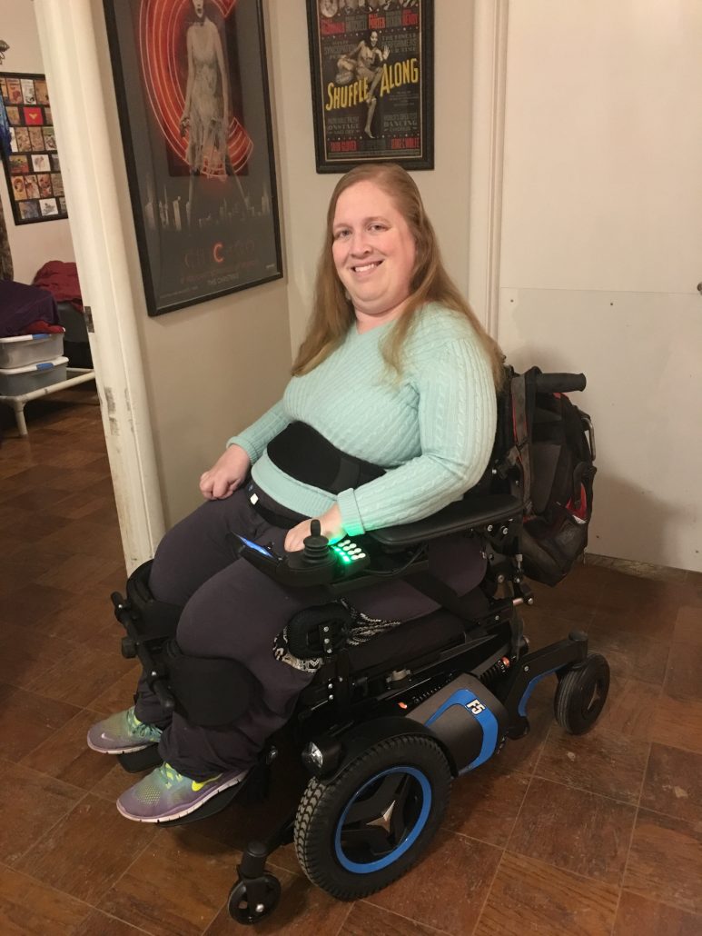 Karin sitting in her Permobil F5 VS power wheelchair.