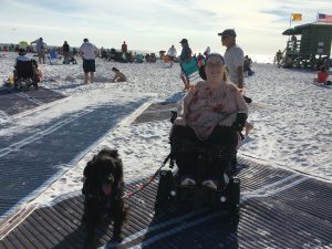 Karin and Aria enjoying the mobi-mat wheelchair accessible path on Siesta Key Beach near Sarasota, Florida.