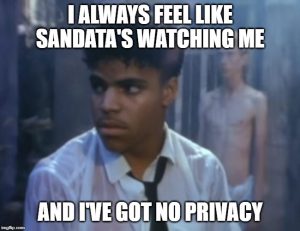 Sandata is spying on people with disabilities. Meme of Rockwell with text "I always feel like Sandata's watching me, and I've got no privacy.