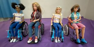 Barbie dolls in wheelchairs from the 1990s and 2019.