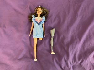 Amputee Barbie, showing her prosthetic leg detached.