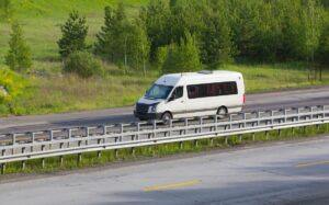 White van on a country road.